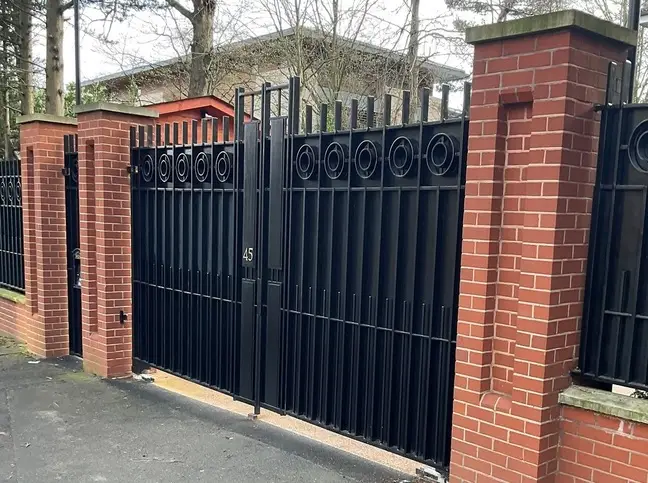 Large, ornate black, steel gate, created and installed by 24 Hour Welding